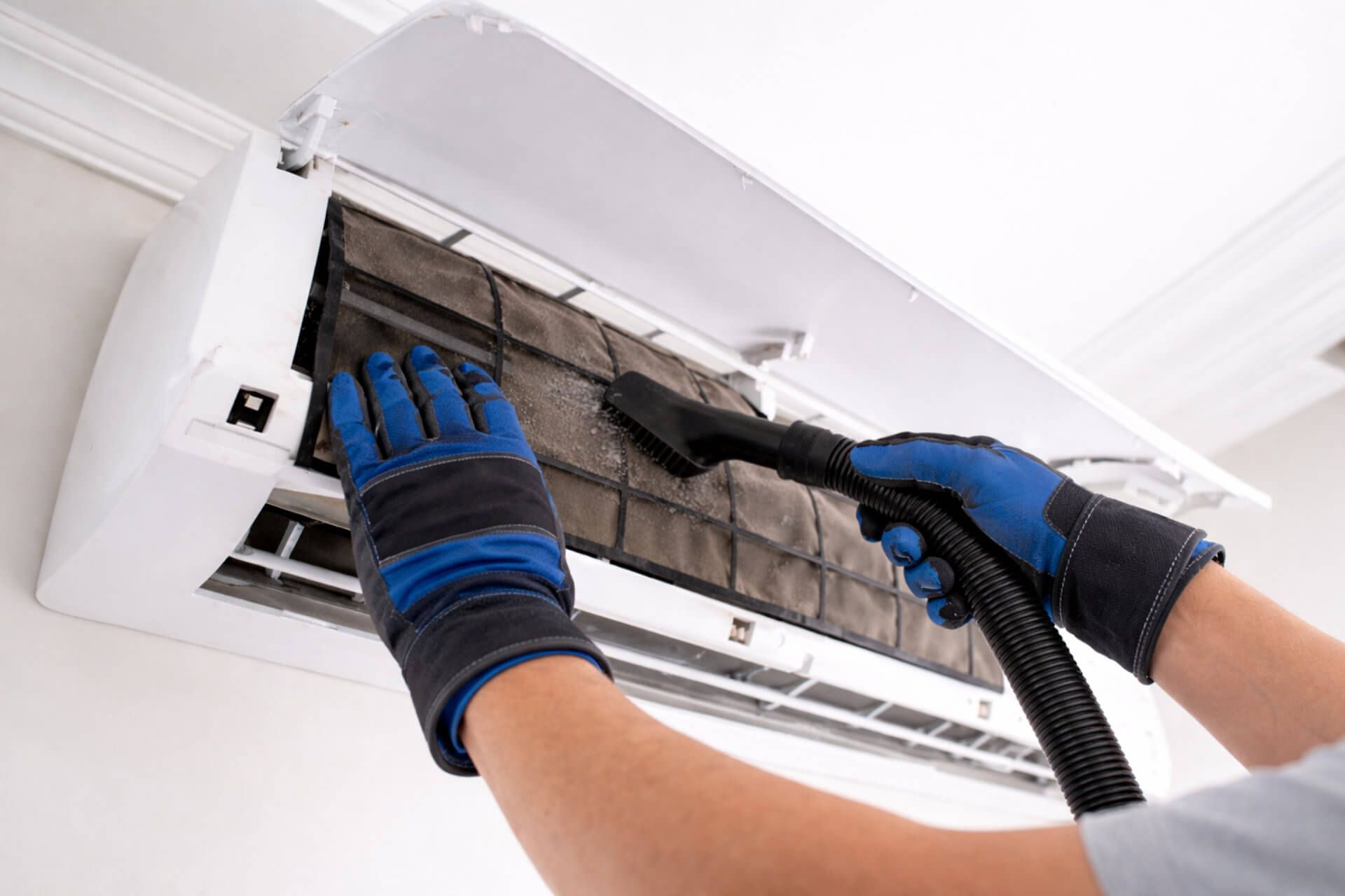 Air conditioning unit being cleaned